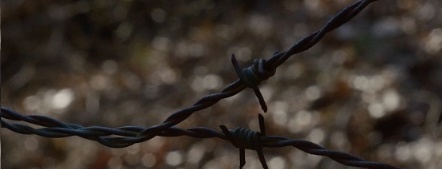 Barbed wire around abandoned coal mine