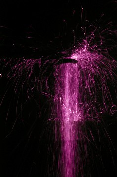 Ultraviolet photo of sparks from grinding steel