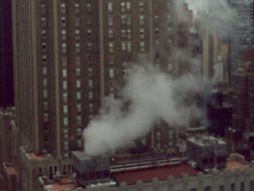 Water vapor coming from a roof condenser in New York