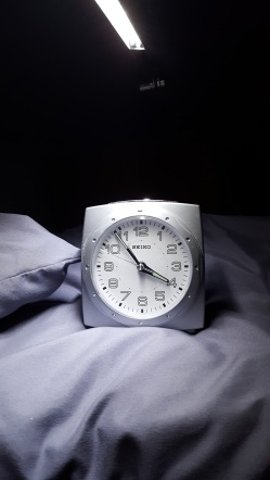 Clock on a bed